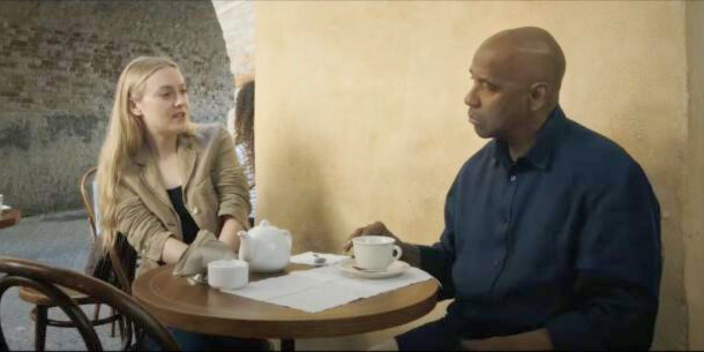 Denzel Washington and Dakota Fanning sitting at a table in The Equalizer 3